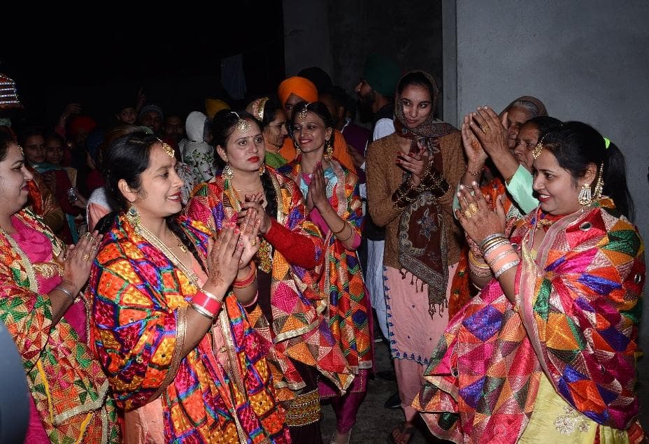 Women in scarf with Phulkari design