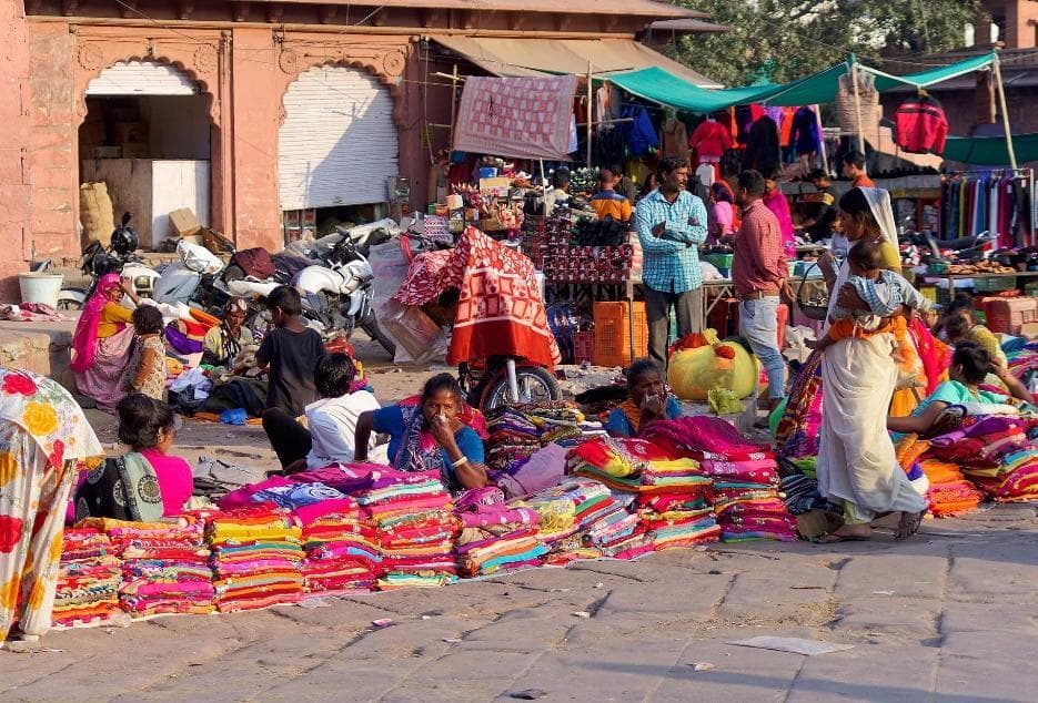 Small shops with children playing nearby