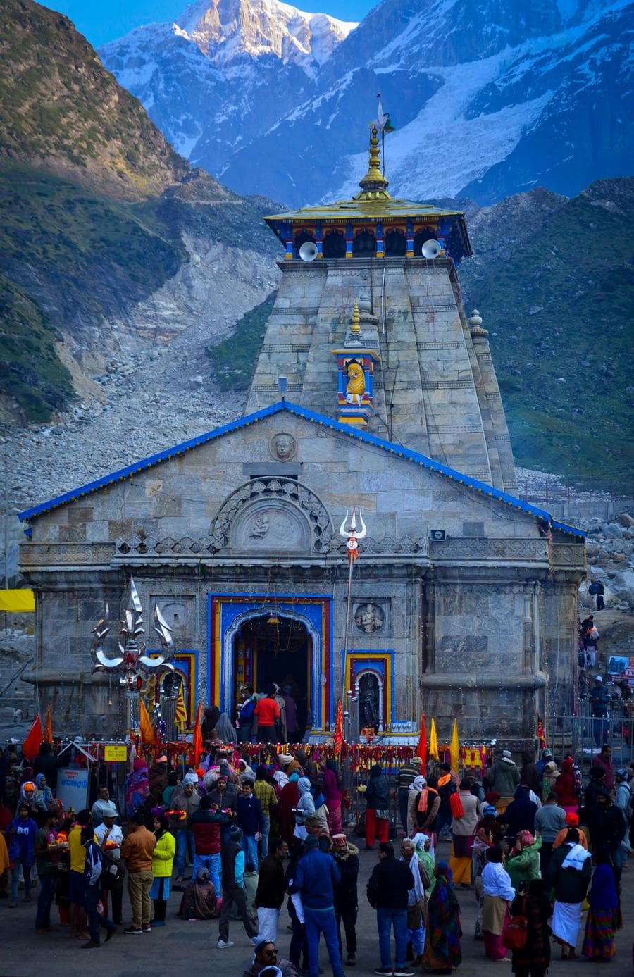A group of people standing in front of a temple