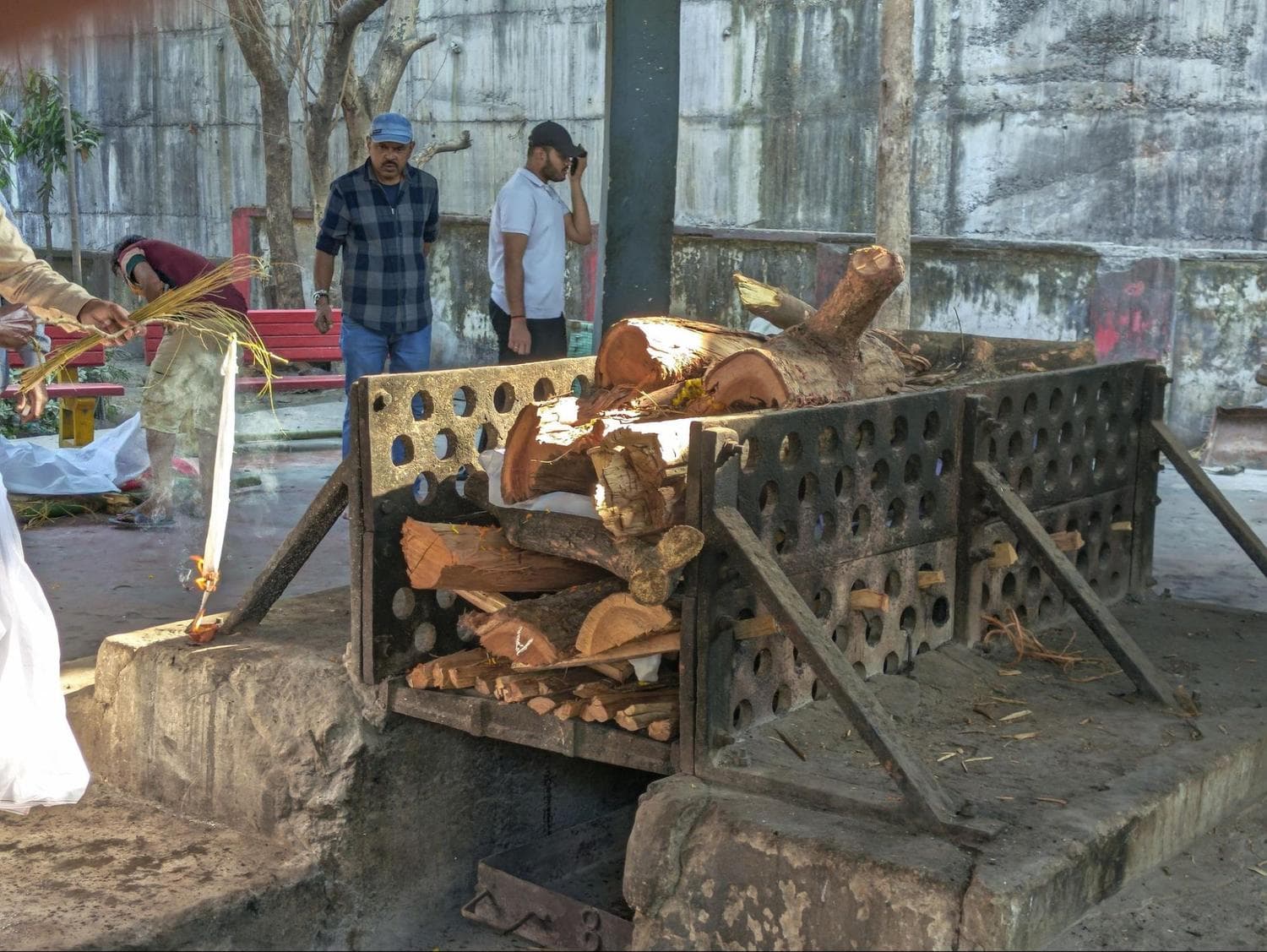 Timber fills the pit before cremation